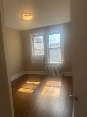 an empty room with a empty space and windows