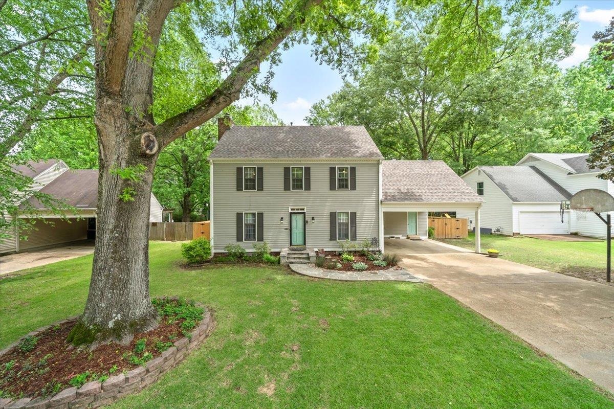 396 Dove Valley Road Collierville, TN 38017 - Photo 1 of 30 a front view of a house with garden