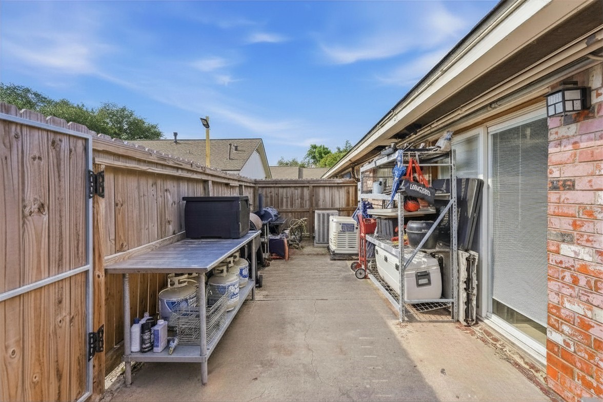 9458 Neuens Road, Unit 9458 Houston, TX 77080 - Photo 18 of 22 Back Exterior. Natural gas generator included in sale! Powers the whole house!
