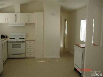 3309 Santa Rosa Avenue, Unit 51 Santa Rosa, CA 95407 - Photo 6 of 6 a kitchen with white cabinets and white appliances