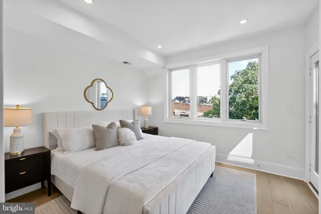 a bedroom with a large bed and a window