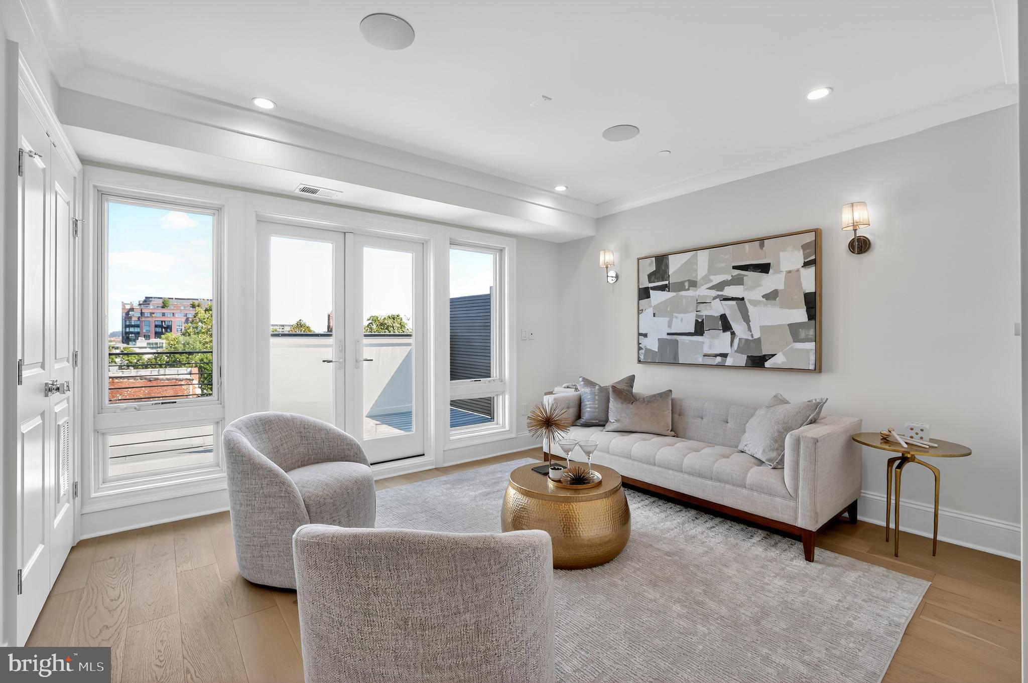1335 11th Street Northwest, Unit PH2 Washington, DC 20001 - Photo 17 of 25 a living room with furniture and a large window