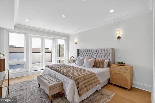 a bedroom with a bed and a view of walk in closet