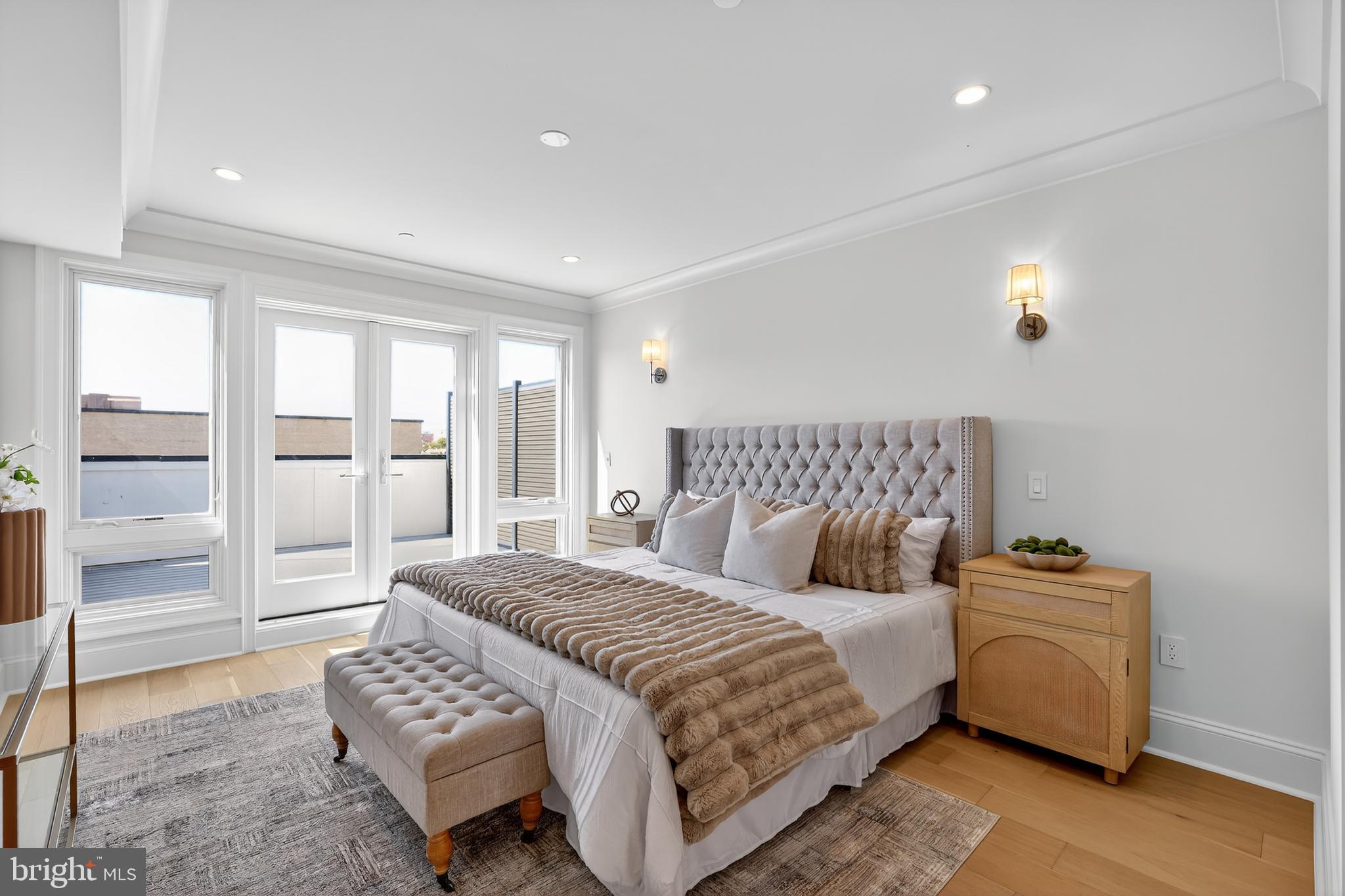 1335 11th Street Northwest, Unit PH2 Washington, DC 20001 - Photo 22 of 25 a bedroom with a bed and a view of walk in closet