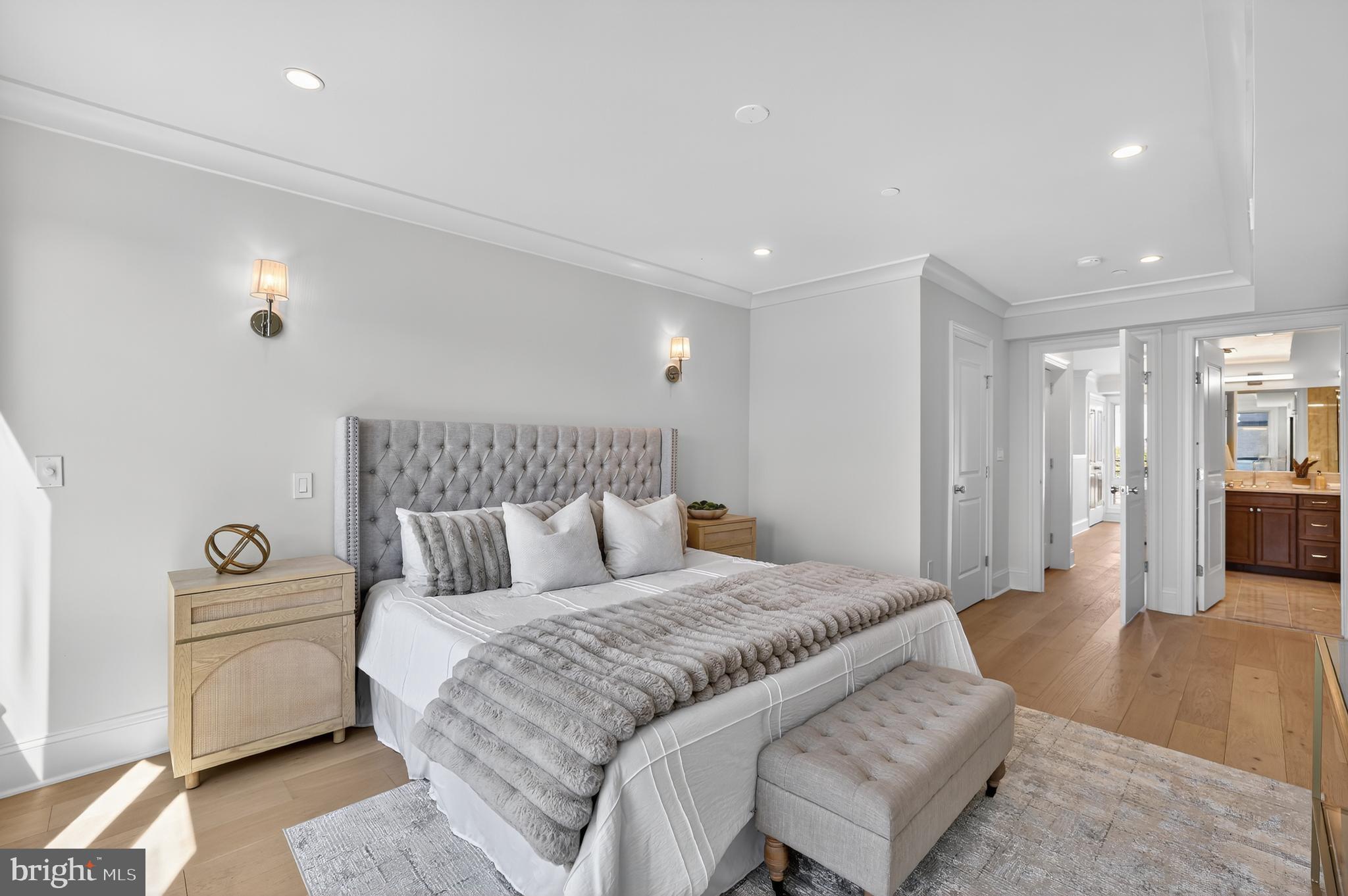 1335 11th Street Northwest, Unit PH2 Washington, DC 20001 - Photo 23 of 25 a spacious bedroom with a bed and a couch