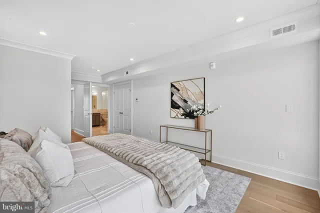 a bedroom with a bed and a table