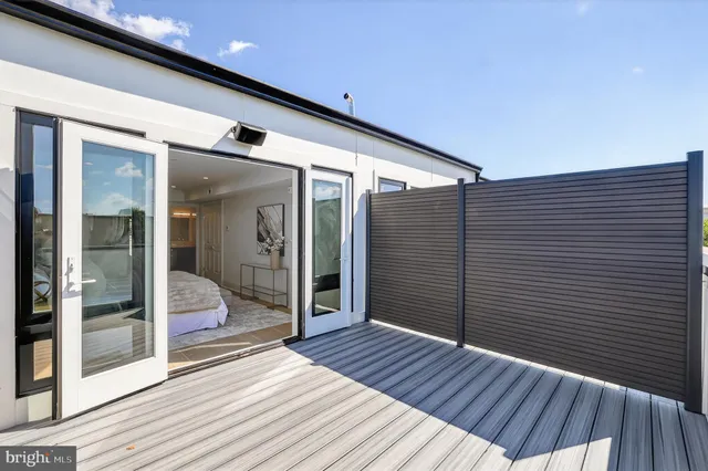 a view of a balcony with wooden floor