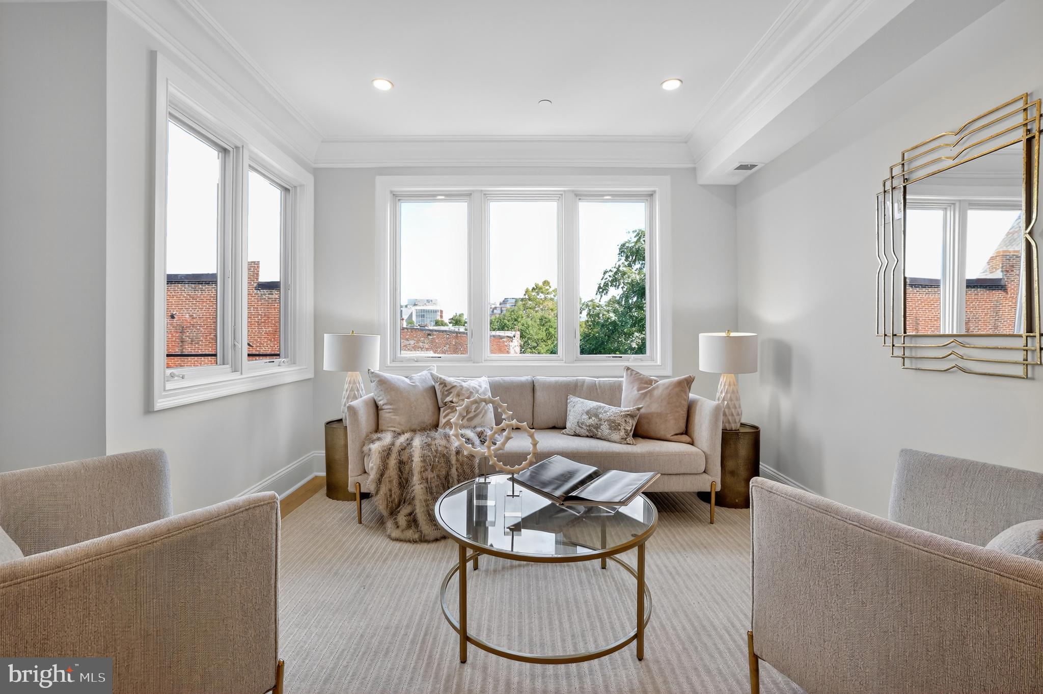 1335 11th Street Northwest, Unit PH2 Washington, DC 20001 - Photo 8 of 25 a living room with furniture and a window