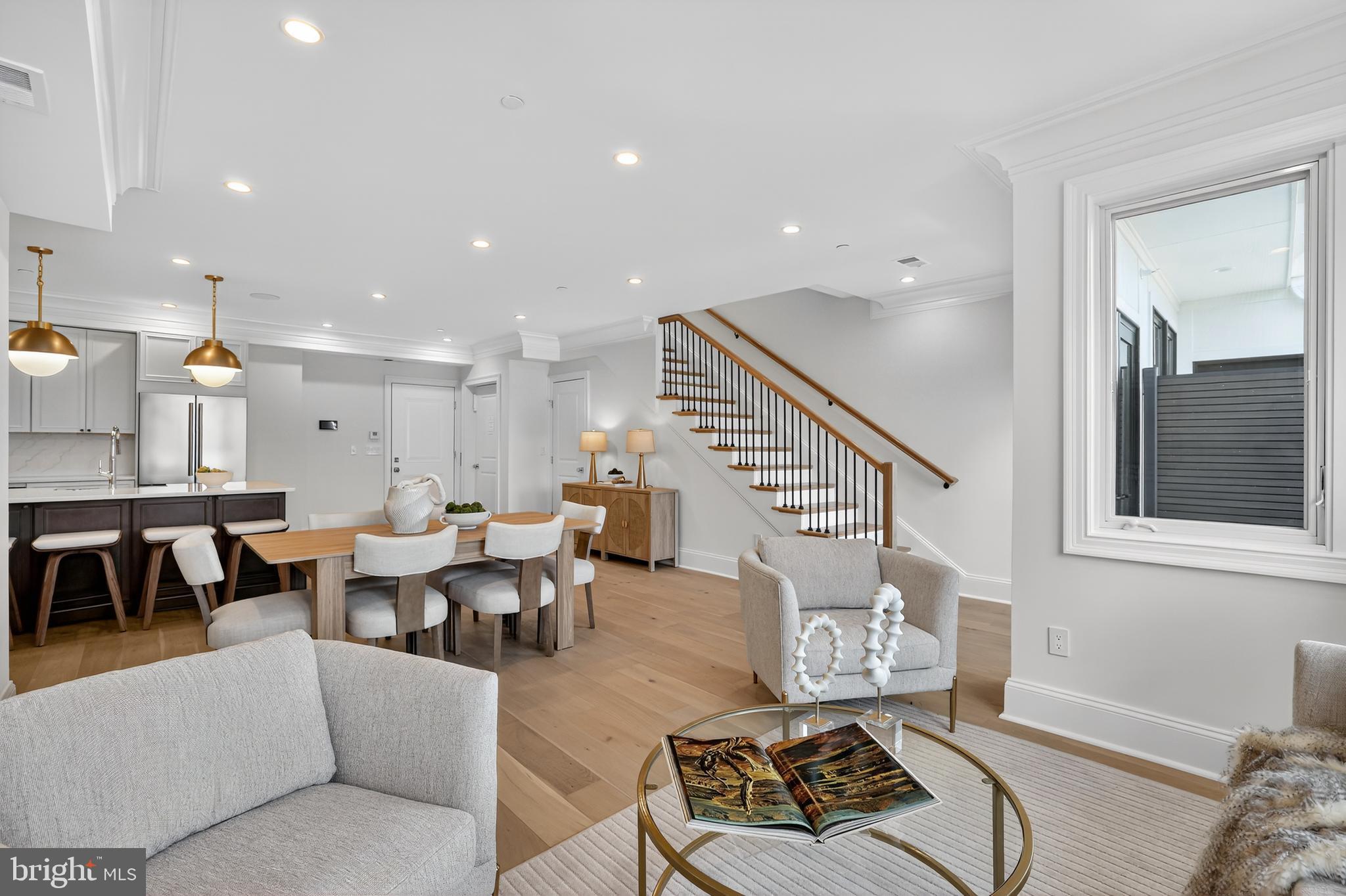 1335 11th Street Northwest, Unit PH2 Washington, DC 20001 - Photo 9 of 25 a living room with furniture wooden floor and a window