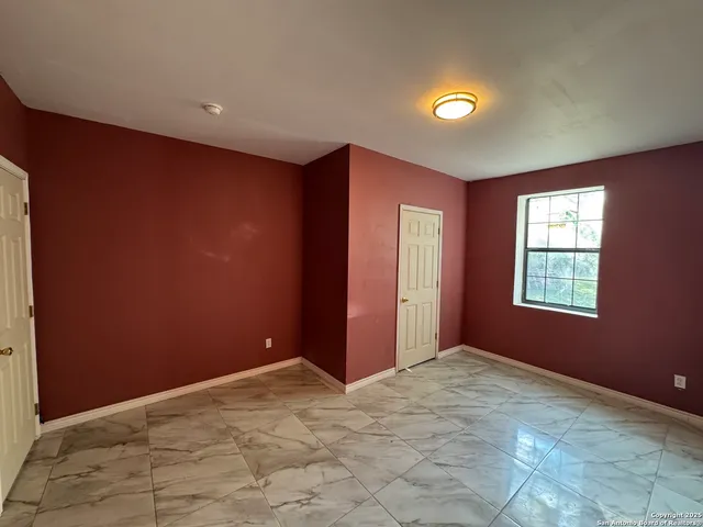 a white toilet sitting next to a bathroom sink