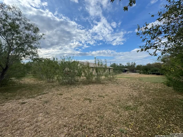 a view of lake with green space