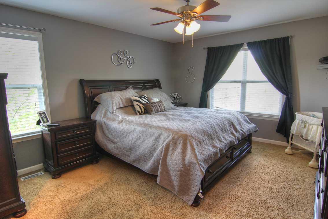 3928 Rowland Road Murfreesboro, TN 37128 - Photo 11 of 25 a bedroom with a bed and a chandelier