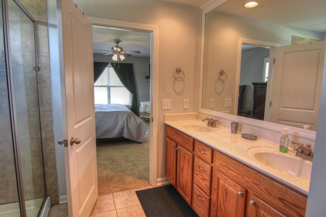 3928 Rowland Road Murfreesboro, TN 37128 - Photo 13 of 25 a en suite bathroom with a double vanity sink and a mirror