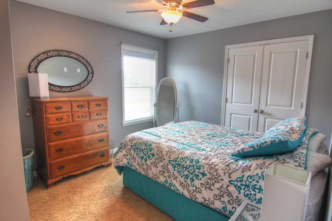 3928 Rowland Road Murfreesboro, TN 37128 - Photo 16 of 25 a bedroom with a bed and a chandelier