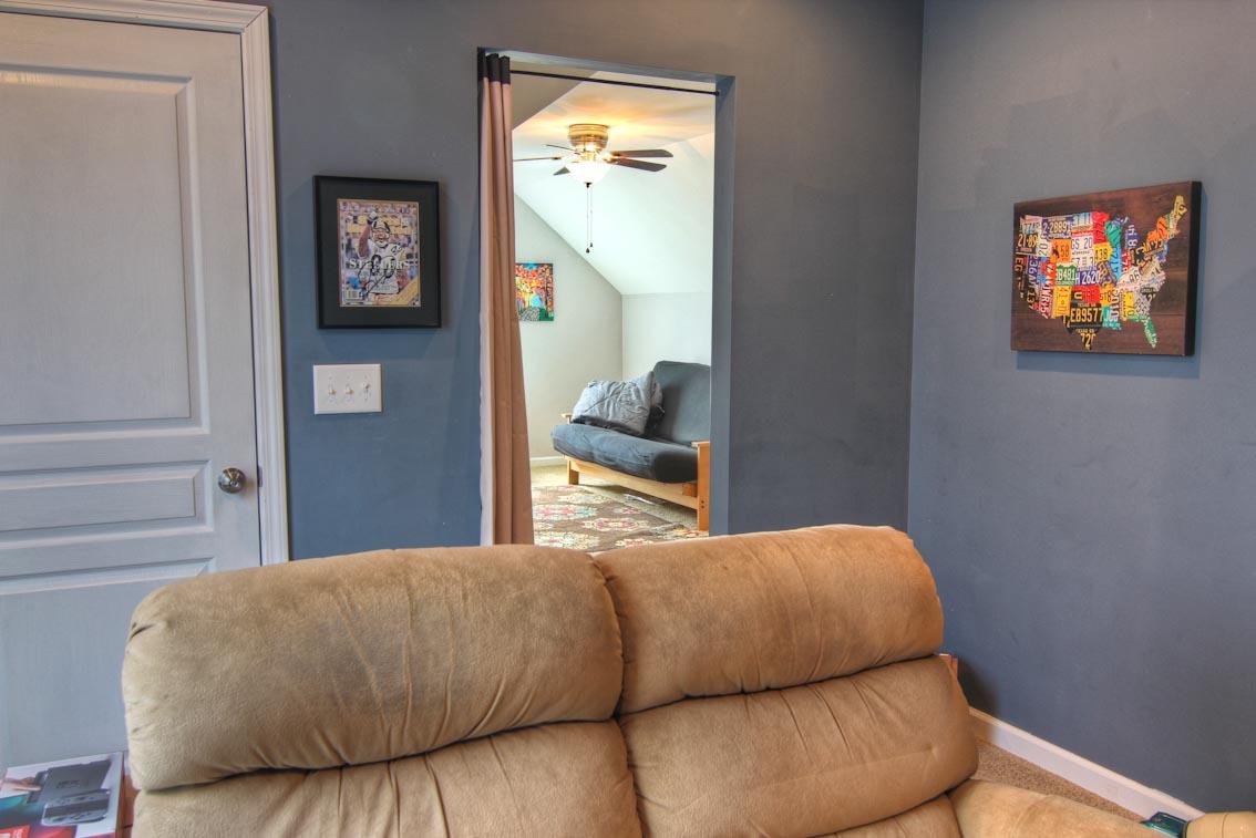 3928 Rowland Road Murfreesboro, TN 37128 - Photo 19 of 25 a bedroom with a bed and wall painting