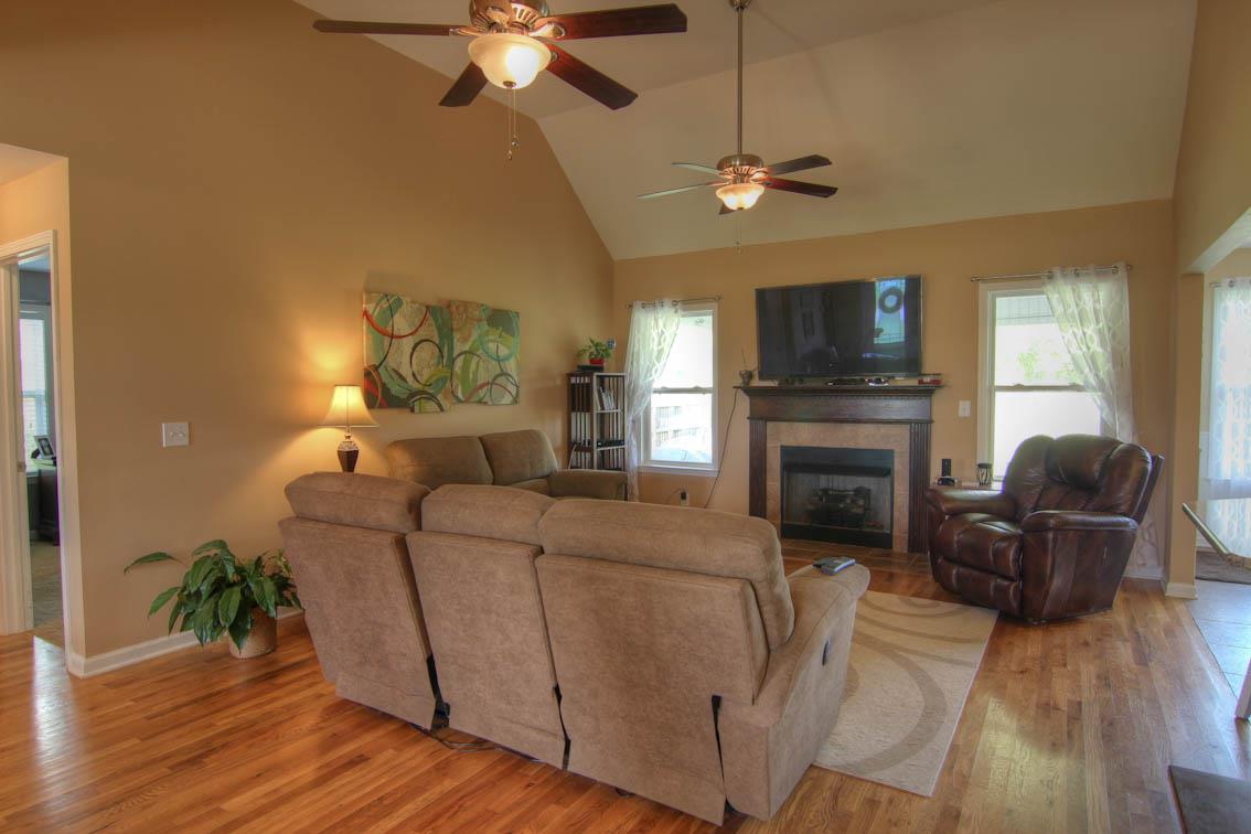 3928 Rowland Road Murfreesboro, TN 37128 - Photo 5 of 25 a living room with furniture a fireplace and a flat screen tv