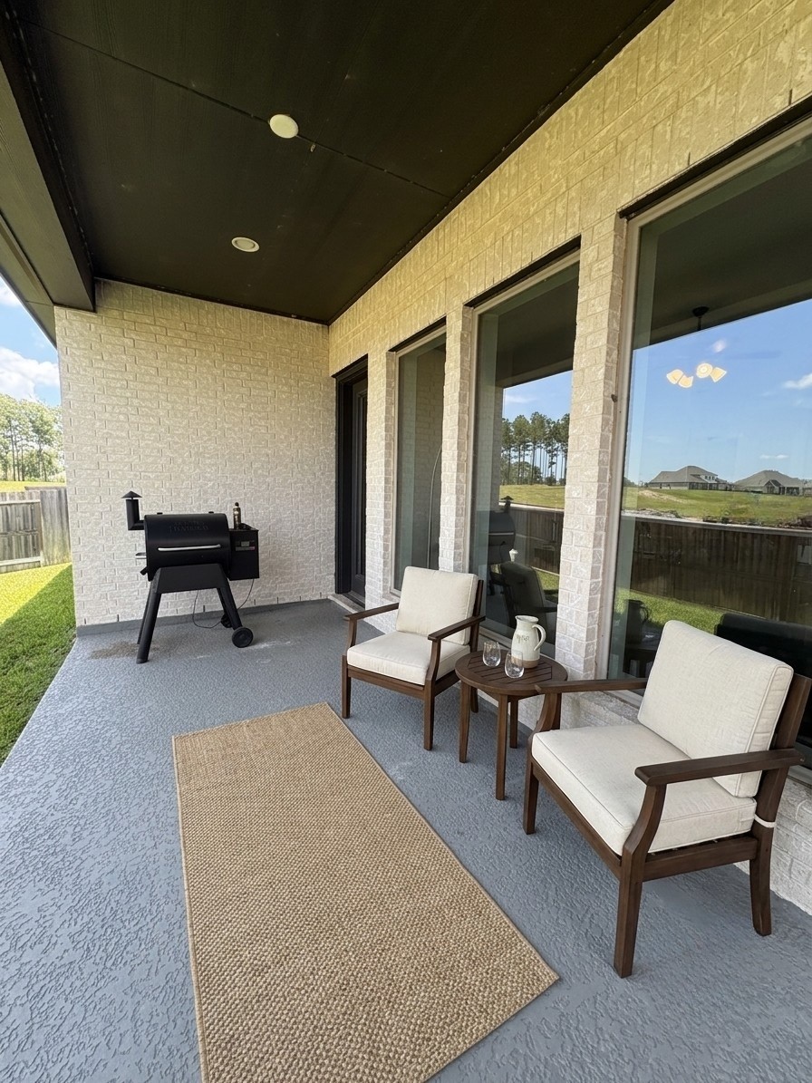 42550 Summer Crest Road Magnolia, TX 77354 - Photo 15 of 15 a patio with patio couch and a table
