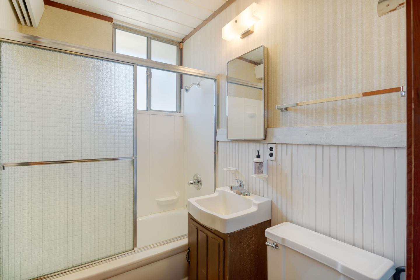 1705 Wolfe Drive San Mateo, CA 94402 - Photo 14 of 22 a bathroom with a sink a toilet and shower