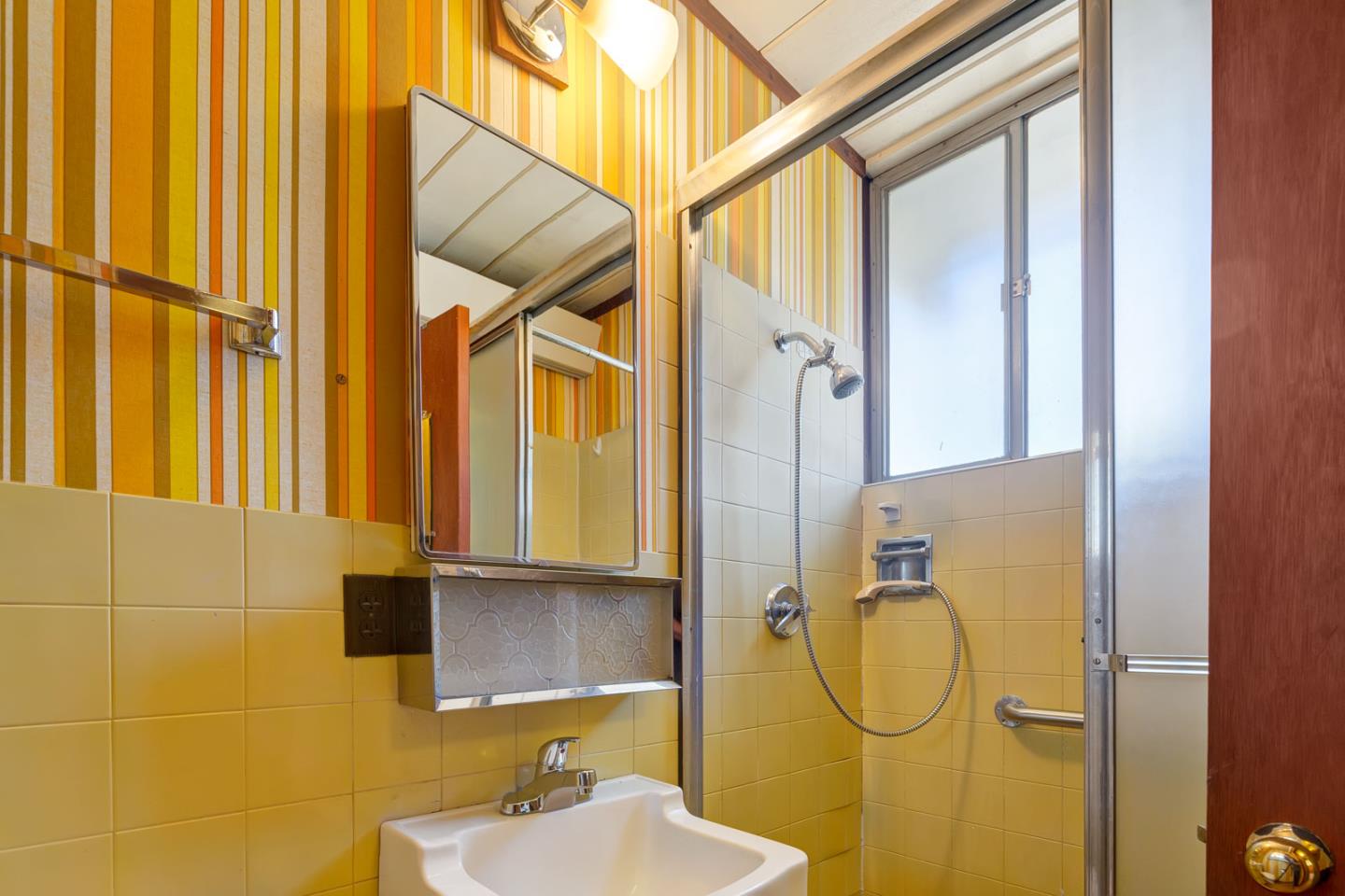 1705 Wolfe Drive San Mateo, CA 94402 - Photo 17 of 22 a bathroom with a sink and mirror