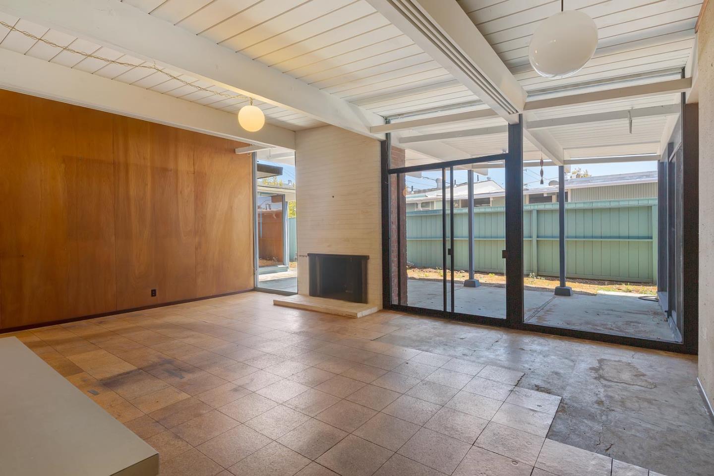 1705 Wolfe Drive San Mateo, CA 94402 - Photo 5 of 22 a view of an empty room with sliding door