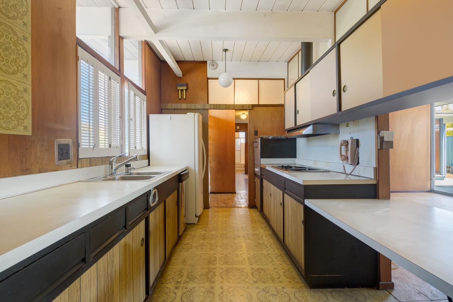1705 Wolfe Drive San Mateo, CA 94402 - Photo 6 of 22 a kitchen with stainless steel appliances granite countertop lots of counter top space and wooden floor