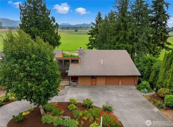 an aerial view of a house with a yard