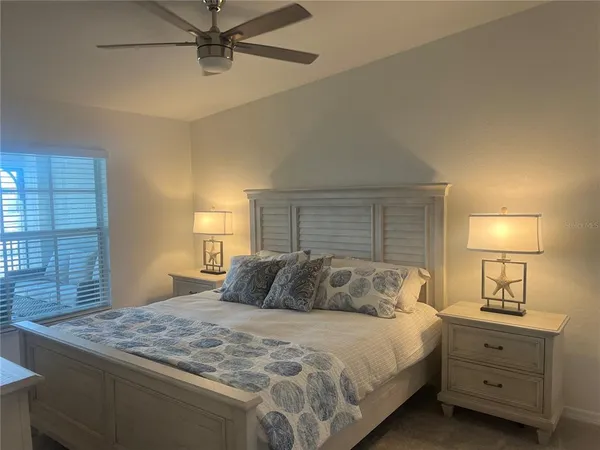 a bedroom with a bed and window