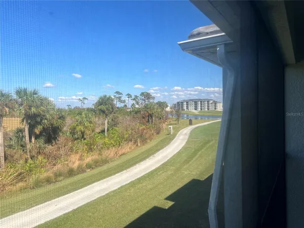 a view of a swimming pool with a balcony