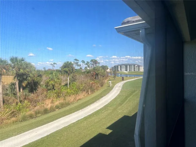 a view of a swimming pool with a balcony