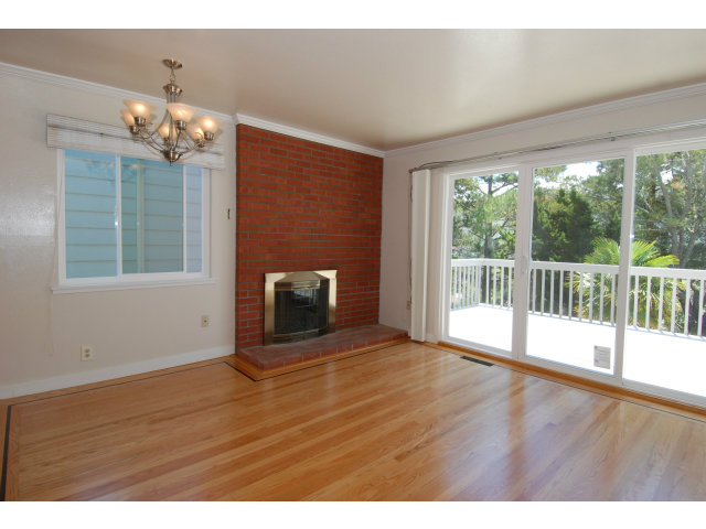 25 Point Reyes Way Pacifica, CA 94044 - Photo 2 of 22 a view of an empty room with wooden floor and a window