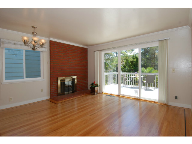 25 Point Reyes Way Pacifica, CA 94044 - Photo 21 of 22 a view of a livingroom with wooden floor and a fireplace