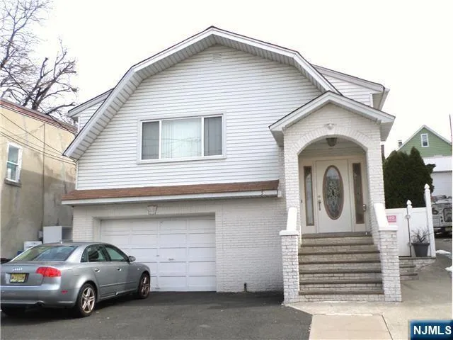 a view of a white house with a large windows
