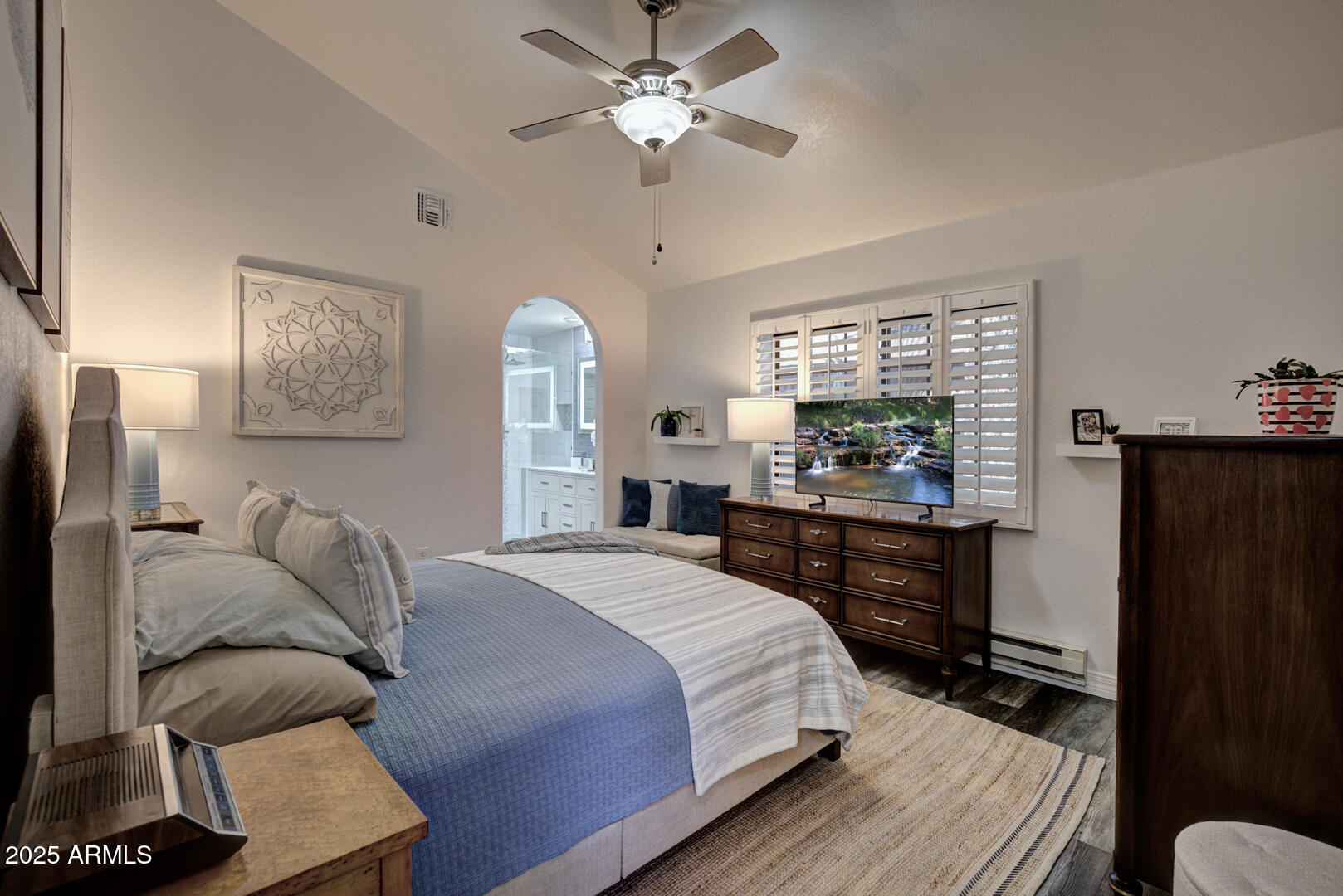 1501 North Beeline Highway, Unit 19 Payson, AZ 85541 - Photo 12 of 31 a bedroom with a bed and a chandelier
