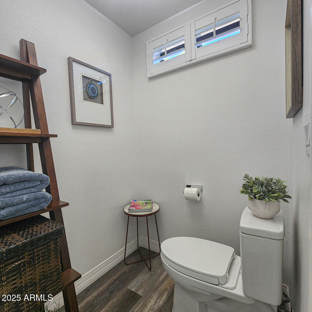 1501 North Beeline Highway, Unit 19 Payson, AZ 85541 - Photo 15 of 31 a white toilet sitting next to a small bathroom