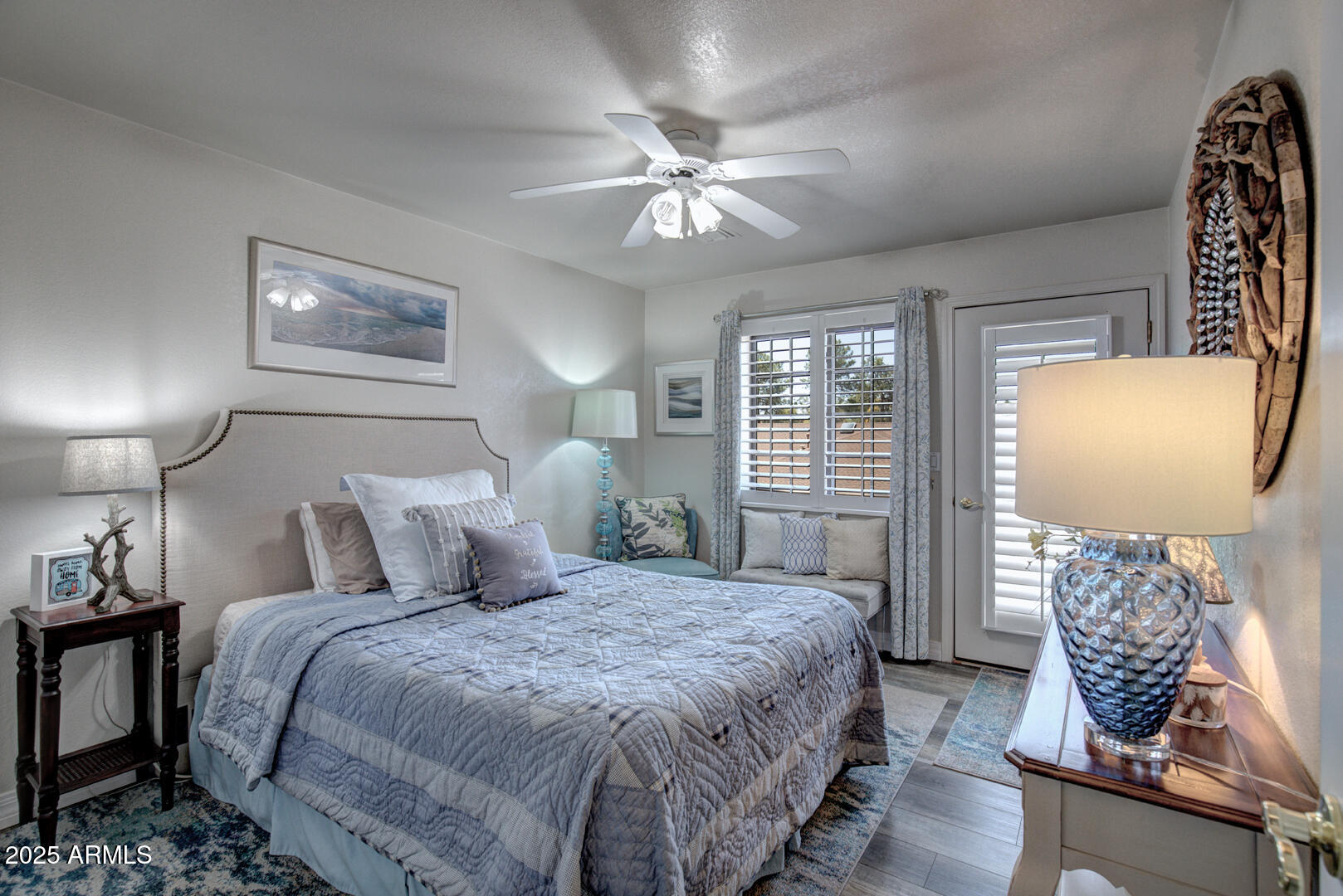 1501 North Beeline Highway, Unit 19 Payson, AZ 85541 - Photo 18 of 31 a bedroom with a bed and a chandelier