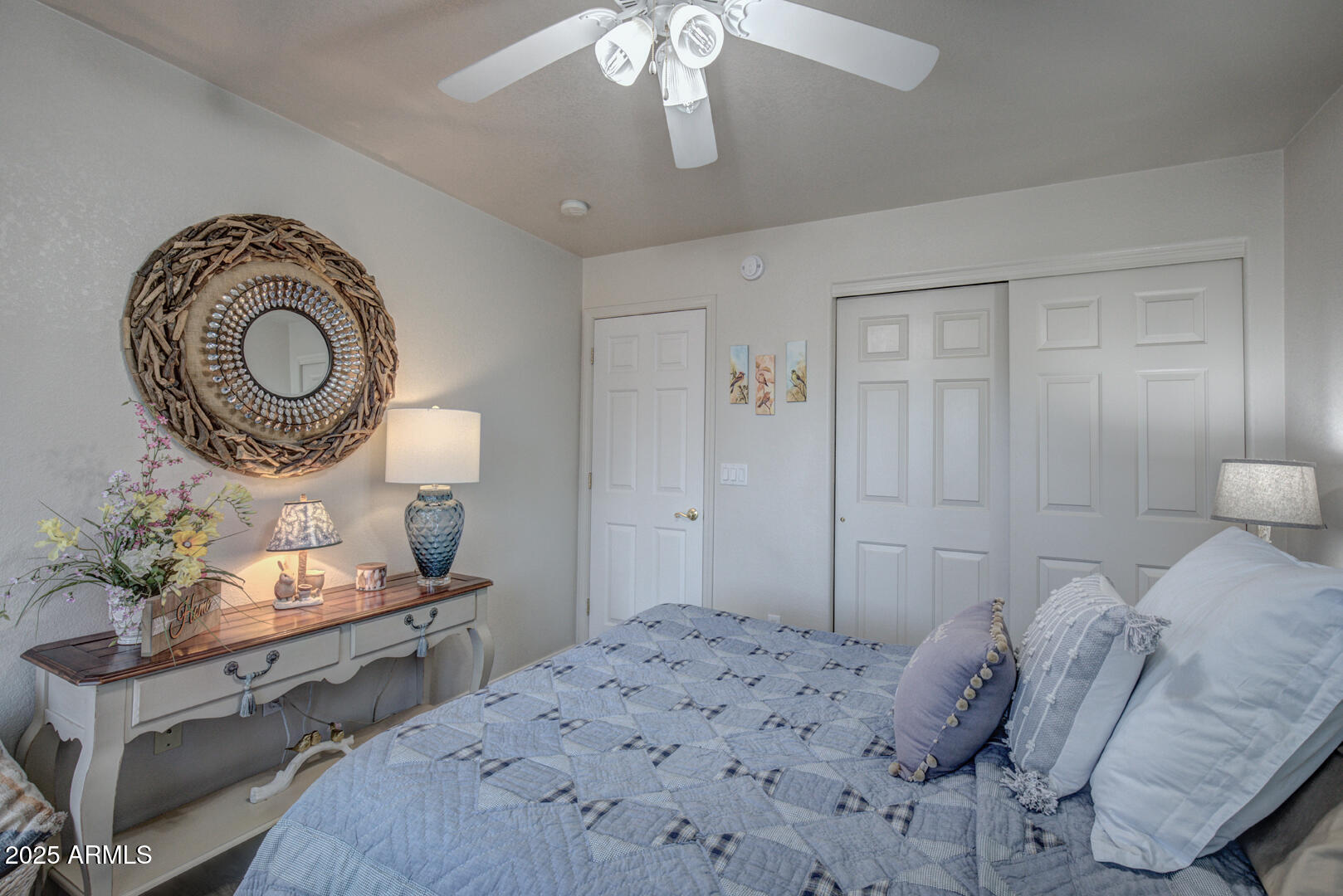 1501 North Beeline Highway, Unit 19 Payson, AZ 85541 - Photo 19 of 31 a bedroom with a bed and a chandelier