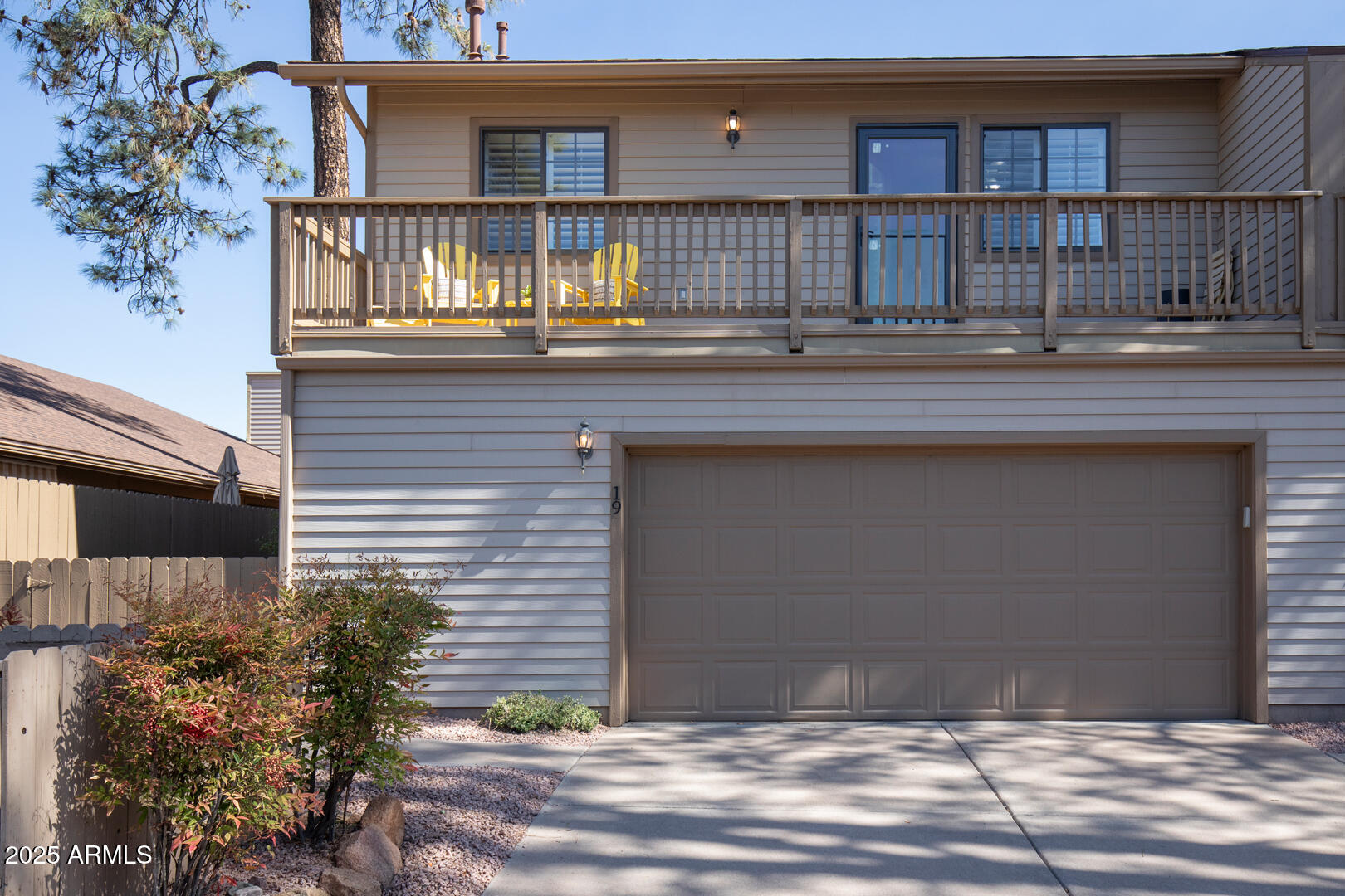 1501 North Beeline Highway, Unit 19 Payson, AZ 85541 - Photo 30 of 31 a front view of a house with a yard and garage