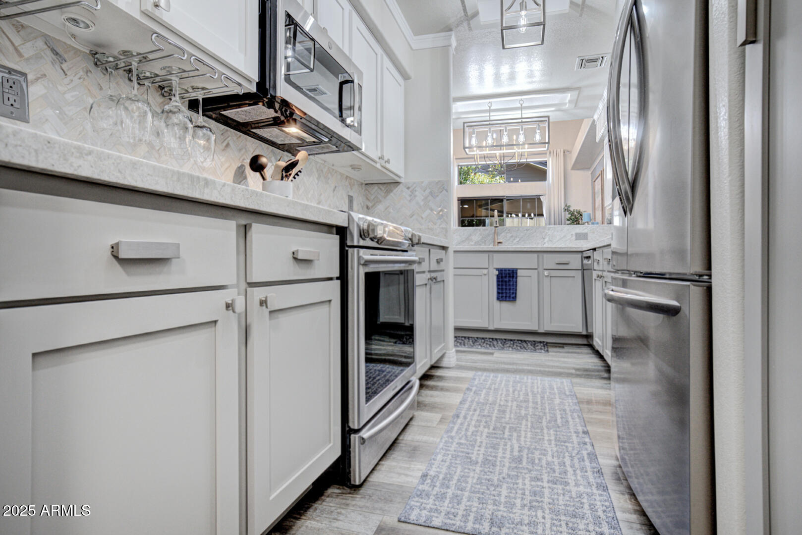 1501 North Beeline Highway, Unit 19 Payson, AZ 85541 - Photo 6 of 31 a kitchen with stainless steel appliances granite countertop a sink stove and refrigerator