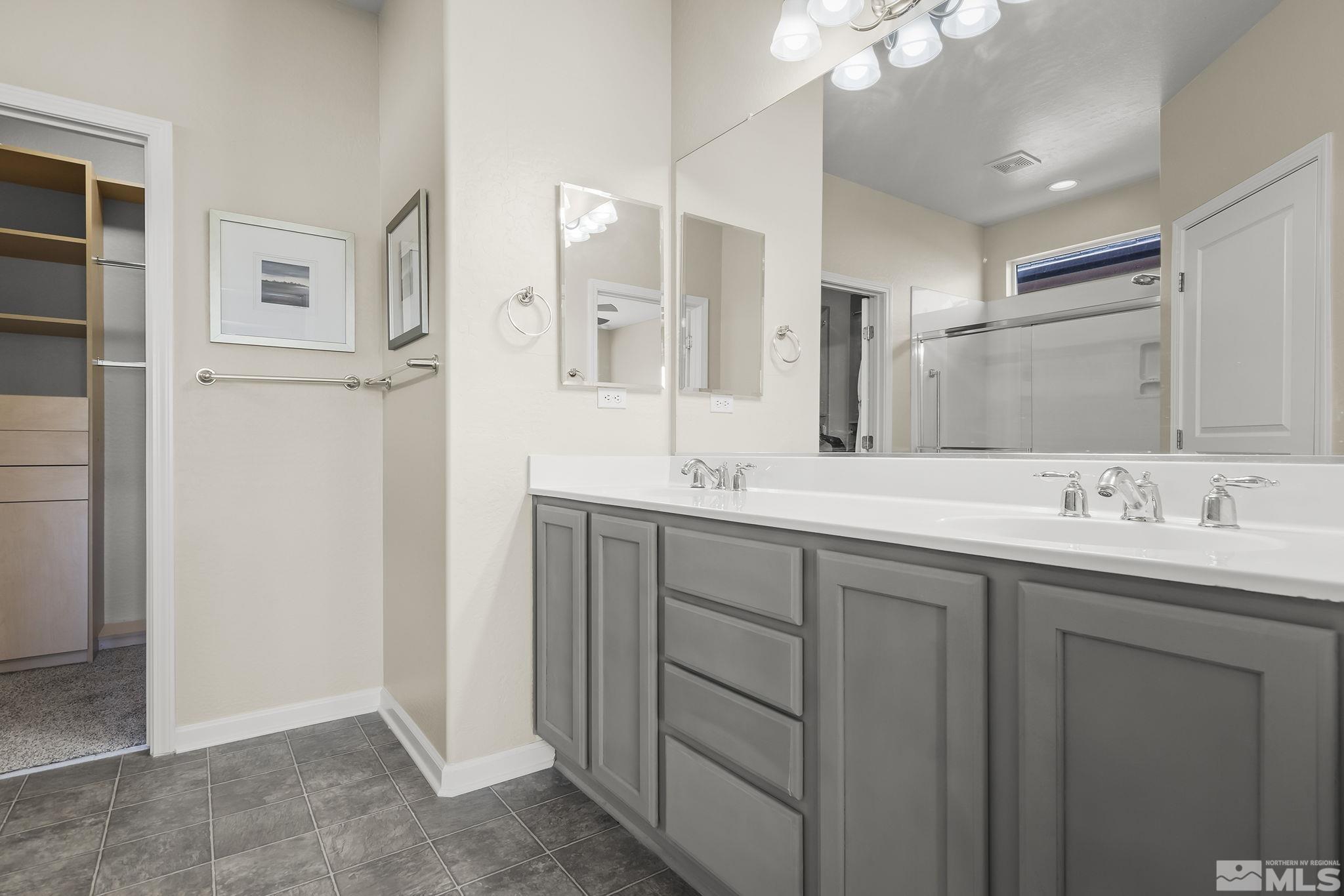 1375 Tarleton Way Reno, NV 89523 - Photo 14 of 22 a bathroom with double sink and a mirror