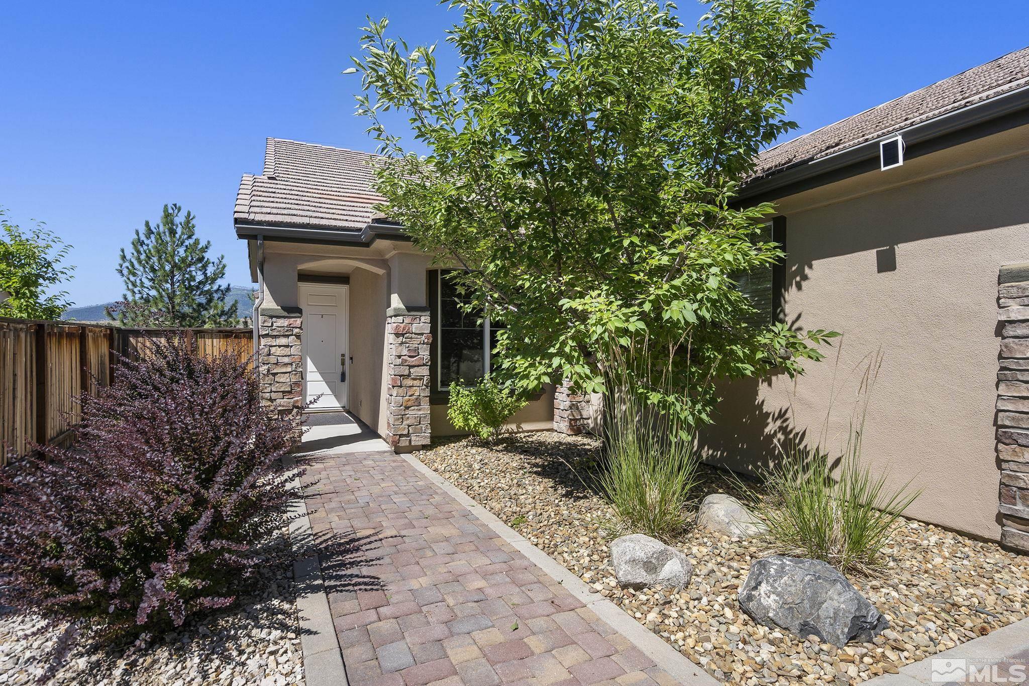 1375 Tarleton Way Reno, NV 89523 - Photo 2 of 22 a pathway of a house with potted plants and wooden fence