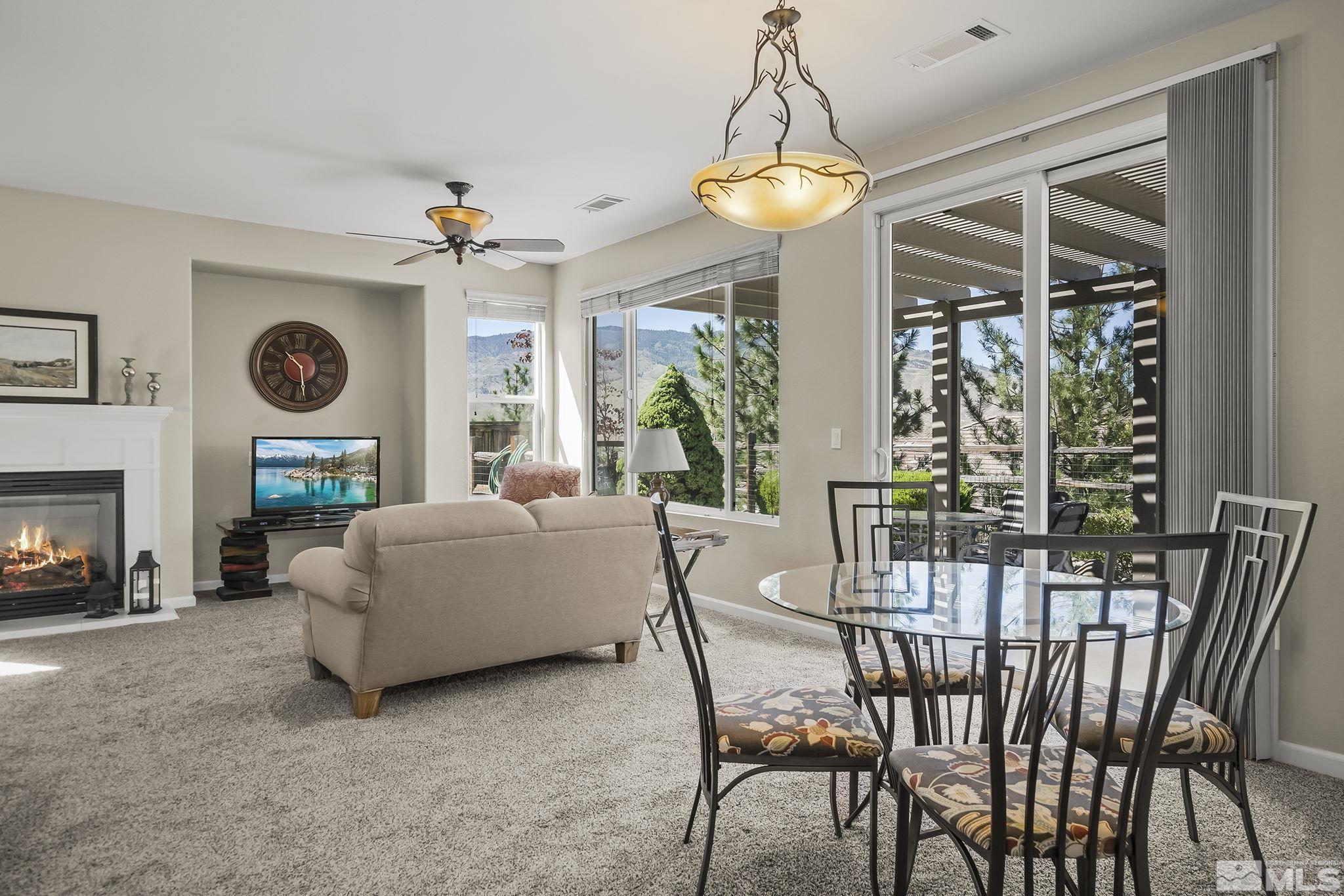 1375 Tarleton Way Reno, NV 89523 - Photo 9 of 22 a living room with furniture and a chandelier