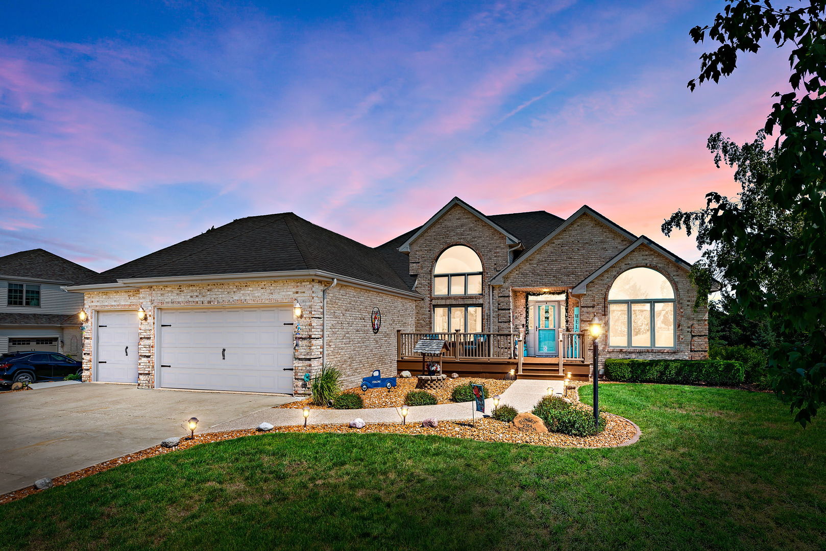 2364 Sunset View Lane Kankakee, IL 60901 - Photo 1 of 35 a front view of a house with a yard and garage