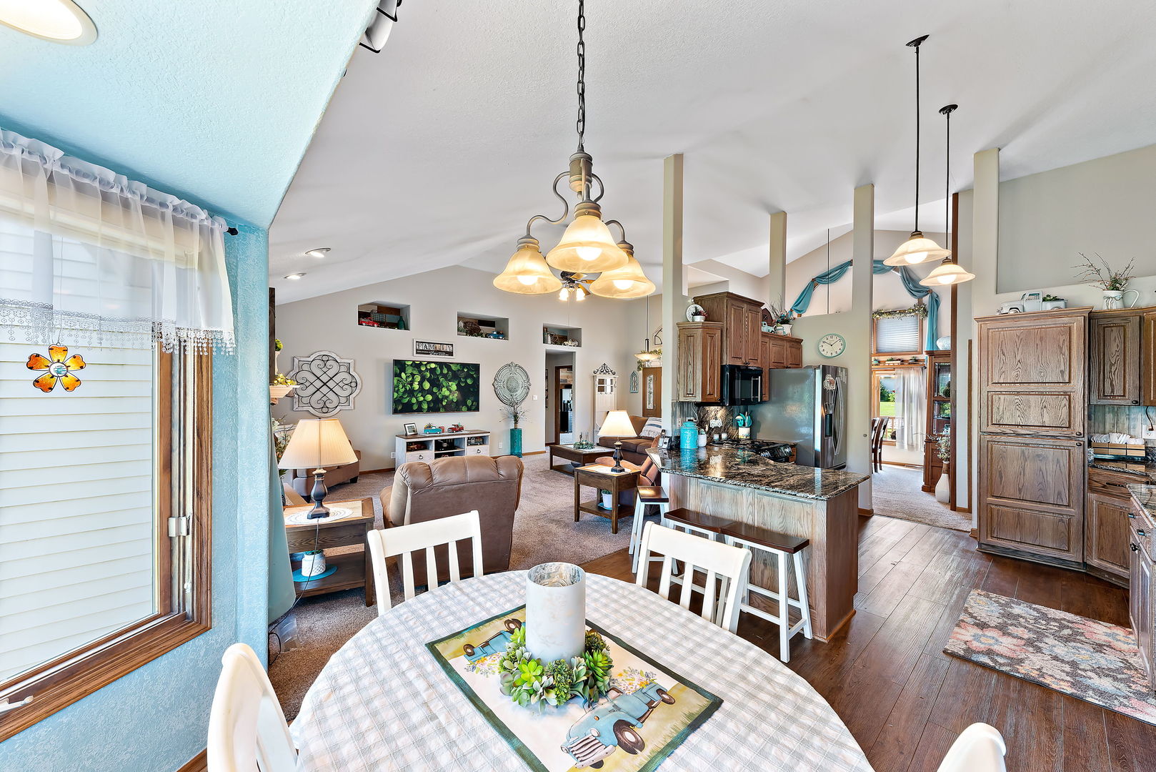 2364 Sunset View Lane Kankakee, IL 60901 - Photo 16 of 35 a living room with lots of furniture and a chandelier