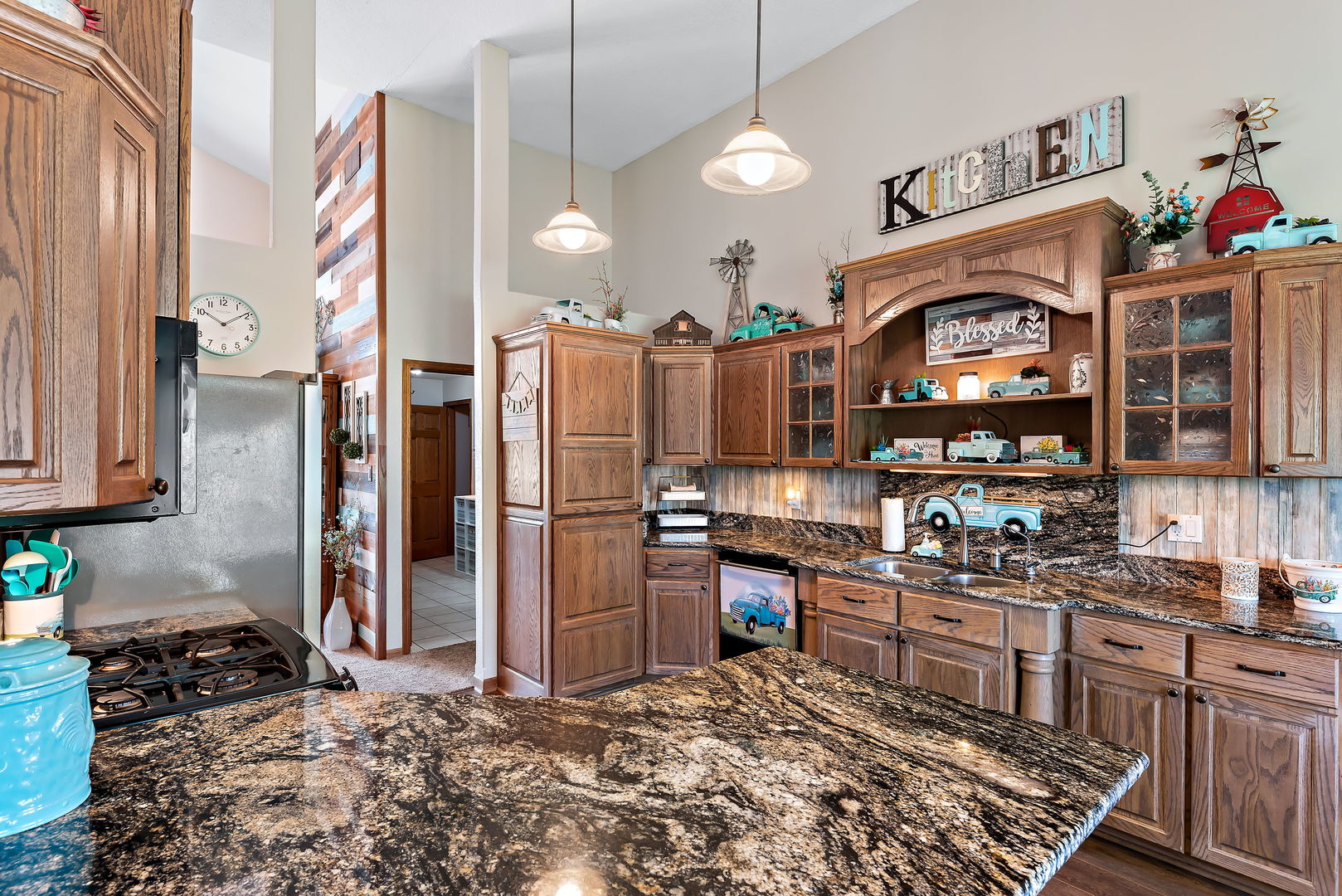 2364 Sunset View Lane Kankakee, IL 60901 - Photo 17 of 35 a kitchen with granite countertop a stove a sink and a refrigerator