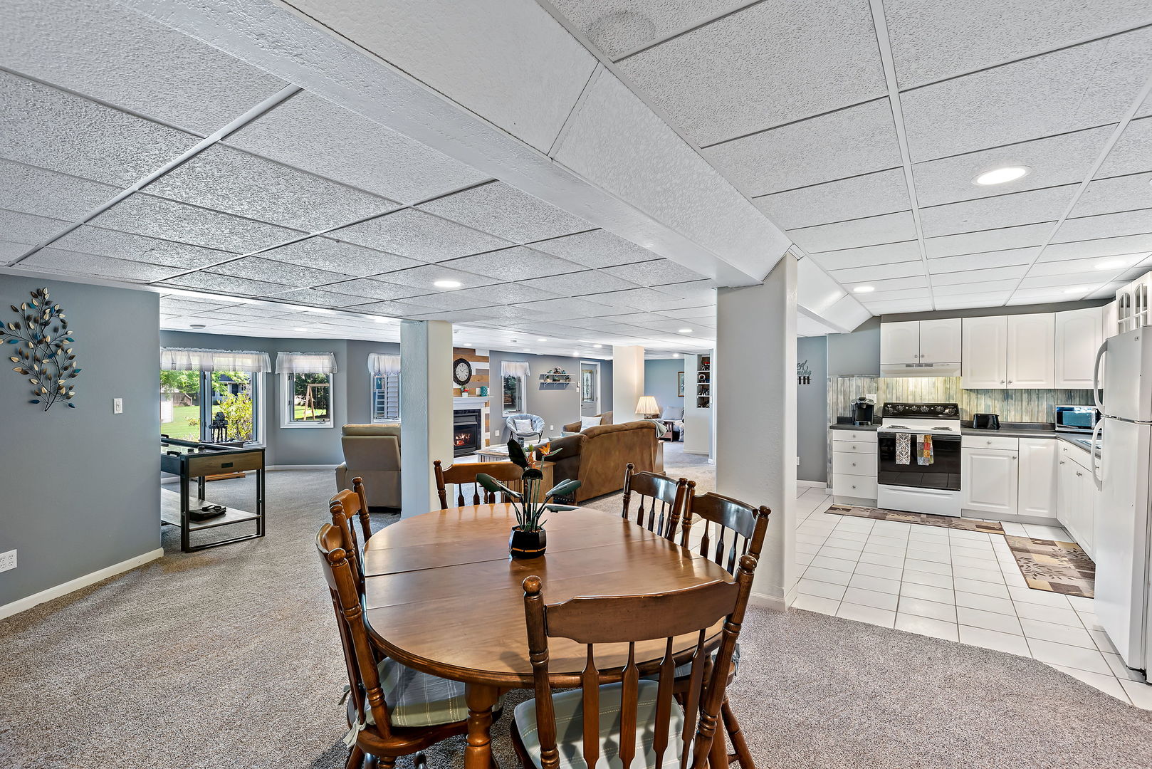 2364 Sunset View Lane Kankakee, IL 60901 - Photo 30 of 35 a dining room with furniture a rug and kitchen view