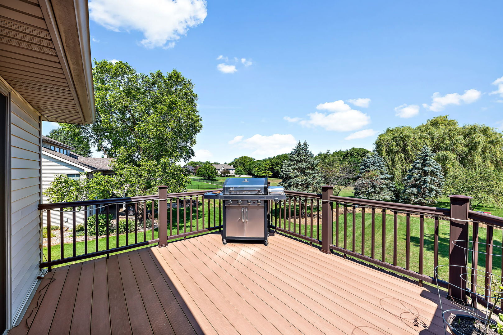 2364 Sunset View Lane Kankakee, IL 60901 - Photo 32 of 35 a view of a wooden deck with a yard