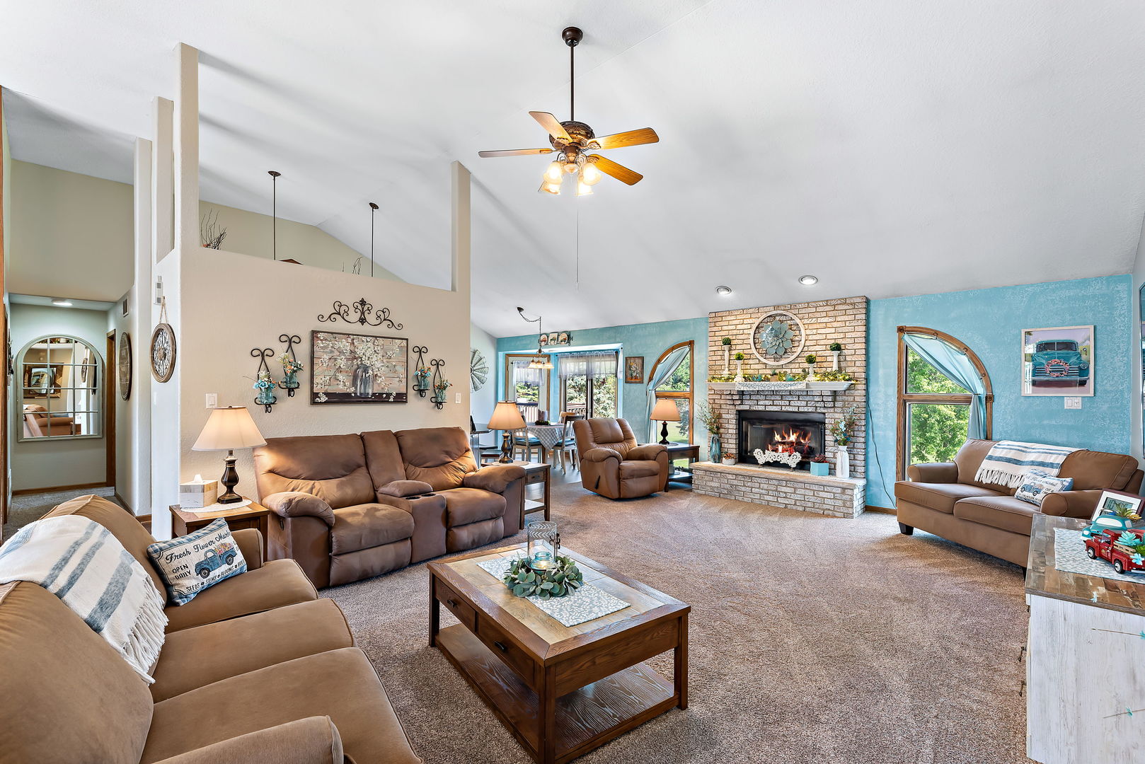 2364 Sunset View Lane Kankakee, IL 60901 - Photo 8 of 35 a living room with furniture a fireplace and a window