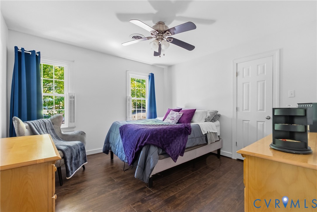 14321 Crossings Ridge Drive Midlothian, VA 23113 - Photo 25 of 43 a bedroom with a bed and wooden floor