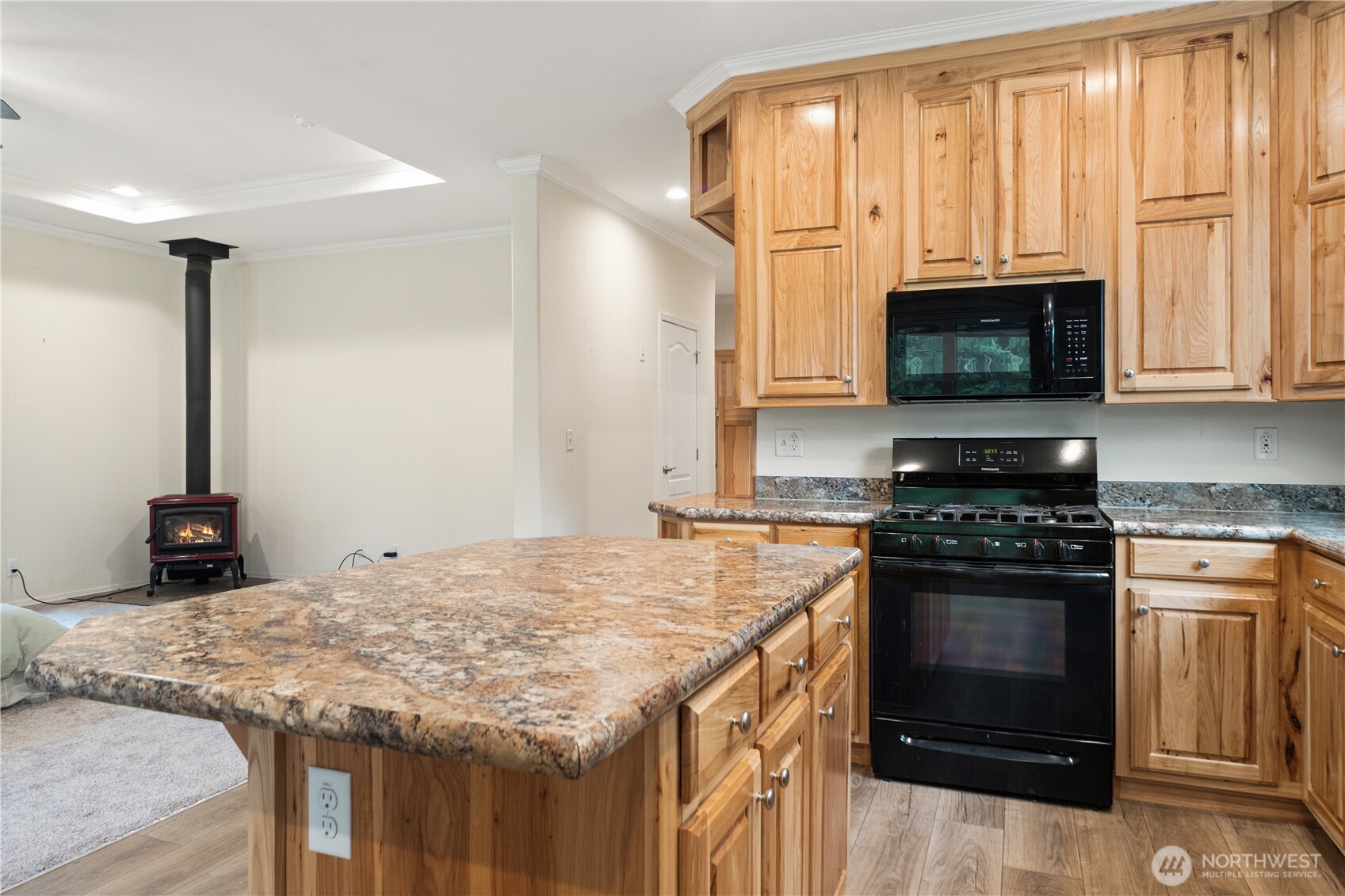 290 Werner Road Port Ludlow, WA 98365 - Photo 13 of 40 a kitchen with granite countertop a stove and a microwave