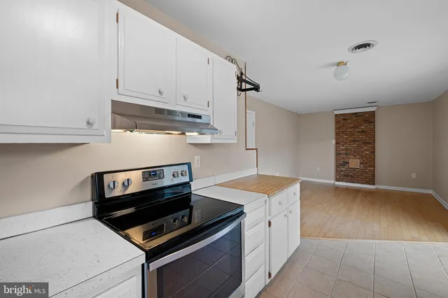 a kitchen with a stove and a microwave